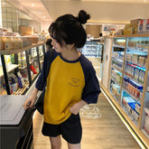 Camisa de manga raglán con letras y bolsillo suelto